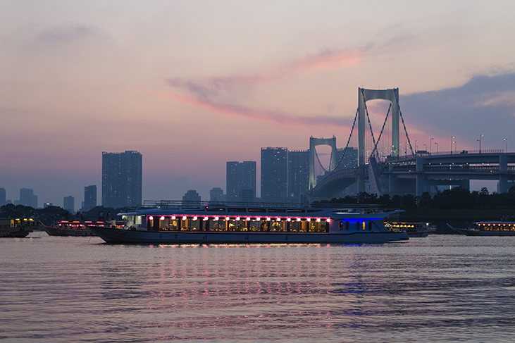 Views of the Rainbow Bridge and ferries from Odaiba Beach