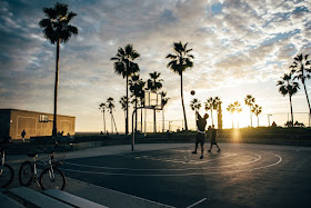 Young men playing basketball, challenge