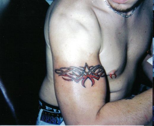 tribal cross tattoos for men. Tribal arm tattoos for men can