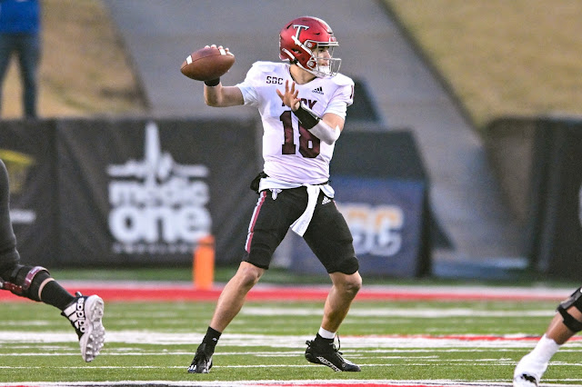 Troy Trojans QB Gunnar Watson readies to pass against the Arkansas State Red Wolves.