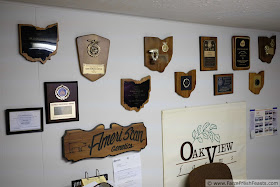 a wall of plaques won by Oakview Farms