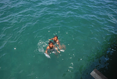Kids swimming in the sea near Floating Restaurant at Baybay Leyte