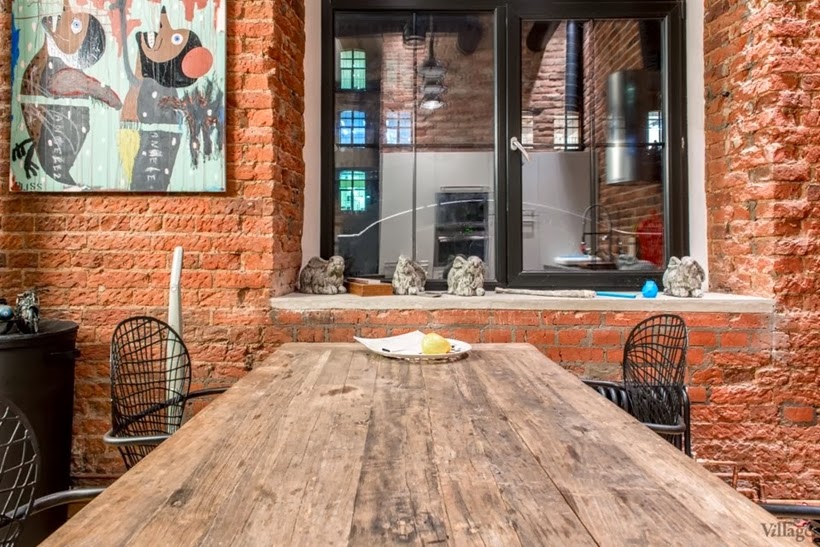 Dining table in Industrial interior design duplex apartment in Moscow