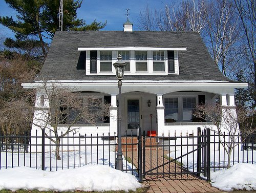 Bungalow with Iron Fence