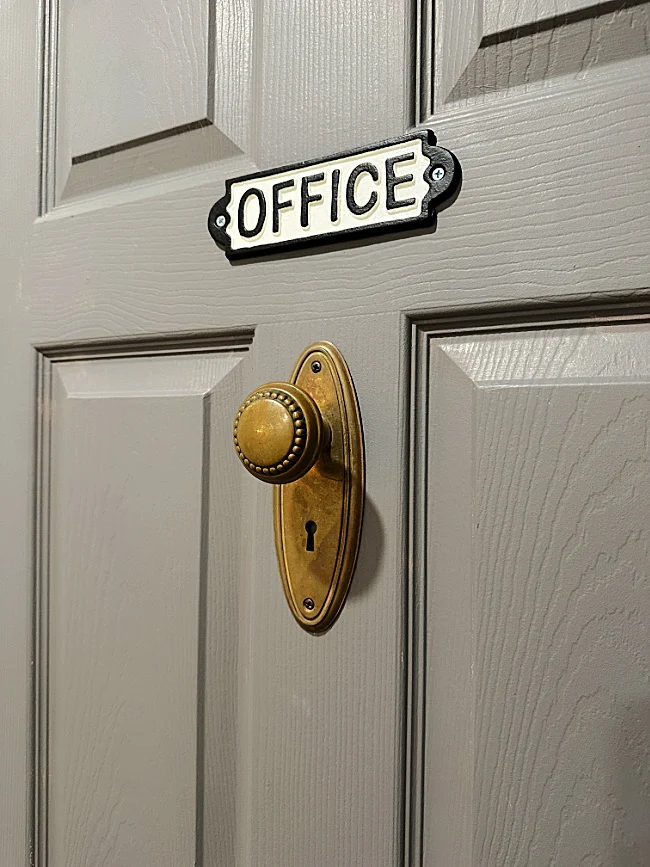 hazelwood grey door with sign and door knob