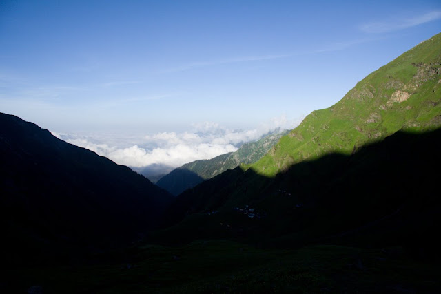 Shrikhand Mahadev Trekking : A wonderful journey through clouds (25th - 30th July 2008): Posted by VJ SHARMA on www.travellingcamera.com :Shrikhand Mahadev Trek (It was a trekking for us)Shrikhand Mahadev is situated at an height of 18,700 ft. above sea level in the Great Himalayan National Park of Himachal Pradesh, India. Trek for Shrikhand mahadev starts from Jaon village in Nirmand region of Kullu district (Himachal Pradesh)RAMPUR-NIRMAND:Satluj river view from roadside between Rampur & Nirmand.JAON VILLAGE: Jaon village is in Nirmand region of Kullu District from where this trekking starts. Don't expect that you can buy few things from this place. So its better to buy the important/useful stuff from Shimla. If you haven't contacted any adventure club for planning this trek for you, then give it a second thought at this place. You can hire a coolie here who can also help you to complete this trek in better way. (Ask for a person called Dhola Ram who can help you for the same)Broken down mud-house on the way to Shrikhand MahadevThere were three dogs in this house to take care of an apple orchid near Jaon village.Small rickety bridge over mountain stream on way to Shrikhand Mahadev (Near Jaon Village)Solitary apple hanging from tree on way to Shrikhand Mahadev. There are lot of apple orchids between Jaon village and Singh Ghat.SINGH-GHATShrikhand river flowing near Singh GhatBarahati:A bubbly and frothing mountain stream on way to Shrikhand Mahadev (Near Barahati)Thacharu : Singh-Ghat to Thacharu is steep stretchA pitched tent on way to Shrikhand Mahadev (Thachru)Valley of Flowers:Beautiful view of Clouds moving around mountains on the way to Shrikhand Mahadev (Near Valley of Flowers)Beautiful view of mountains and clouds from Valley of Flowers on trek to Shrikhand MahadevMountain in shadow on way to Shrikhand Mahadev. You can also see full moon in this pic. This is early morning. Most of the pictures here are shot between 6:00 am & 8:00am. After that it becomes very difficult to see things due to clouds. But its a great feeling to walk through clouds...Shadow of one mountain on top of another on way to Shrikhand MahadevKaali Ghati: This is a hill top, where we reach by crossing 4 hills after Thachru. All are 75 degree steep hills.View of Shrikhand Mahadev from Kaali Ghati: Shrikhand shivalingam can be clearly seen from Kaali ghati before 7:30 am. After that clouds cover the whole area and visibility radius reduces to 15 meters.Bheem Dwari: Bheem Dwari is a beautiful valley on the way to Shrikhand Mahadev. It surrounded by lot of waterfalls from hills covered with snow.Wonderful waterfall view from Bheem Dwari..A small part of longest waterfall in Shrikhand Mahadev Trek...Parvati Bag: Parvati Bag is a place where you see grass last time durin the trek to Shrikhand, the final destination. After this place Rock hills starts with clouds at ground level. So we were literally in clouds after Parvati Bag.Clouds, and sunlight over a mountain on trek to Shrikhand Mahadev (This is morning view from Parvati Bag, when we started third say trek for our final destination: Shrikhand Mahadev)Pitched tent on way to Shrikhand Mahadev (We spent two nights in Parvati Bag)Sunlight coming through hill top : Wonderful view from Kali ghatiSun light crossing though hills...Nain SarovarMountain shadow convering Nain sarovar on the way to Shrikhand Mahadev...DHOLA RAM JI Porter enjoying a cigarette break on way to Shrikhand MahadevCloud Store @ Bheem Paudi (Strains to heaven)Fellow trekkers climbing rock hills between Nain Sarovar and Shrikhand MahadevGlaciers between Nain Sarovar and Shrikhand Mahadev...Rock-made shivalingam on the great heights of mountains. The shivalingam is 72 feet high and stands still at the mountain top, above 18,000 ft altitude.SHRIKHAND MAHADEV TREKKING: Shadow of one mountain on top of another on way to Shrikhand Mahadev