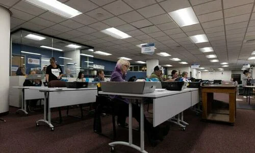 Election officials sort mail-in ballots at the Washoe County Registrar of Voters Office in Reno, Nev., on Nov. 8, 2022.