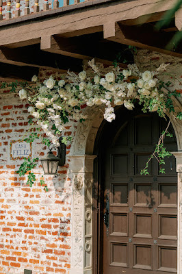 casa feliz wooden door with floral