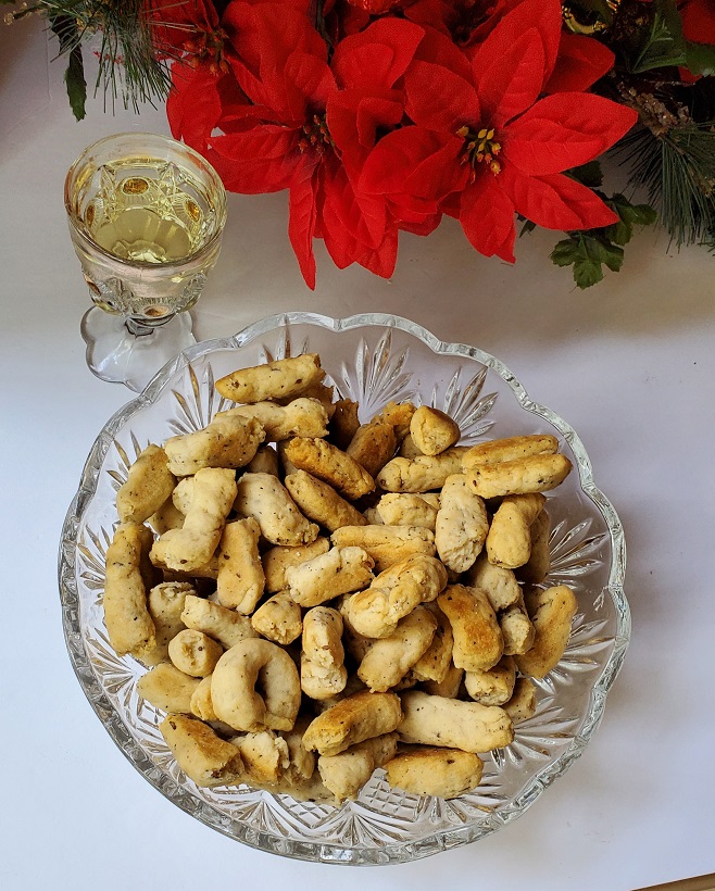 cookies made with white wine and black pepper in stick shapes and rings