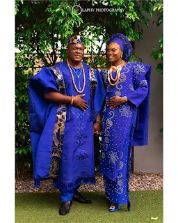 A yoruba bride and groom in aso oke traditional outfit