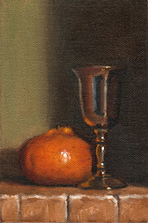 Oil painting of a mandarine beside a small silver-plated goblet.