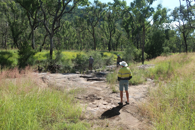 Al walking down to the creek, Darryl at the creek