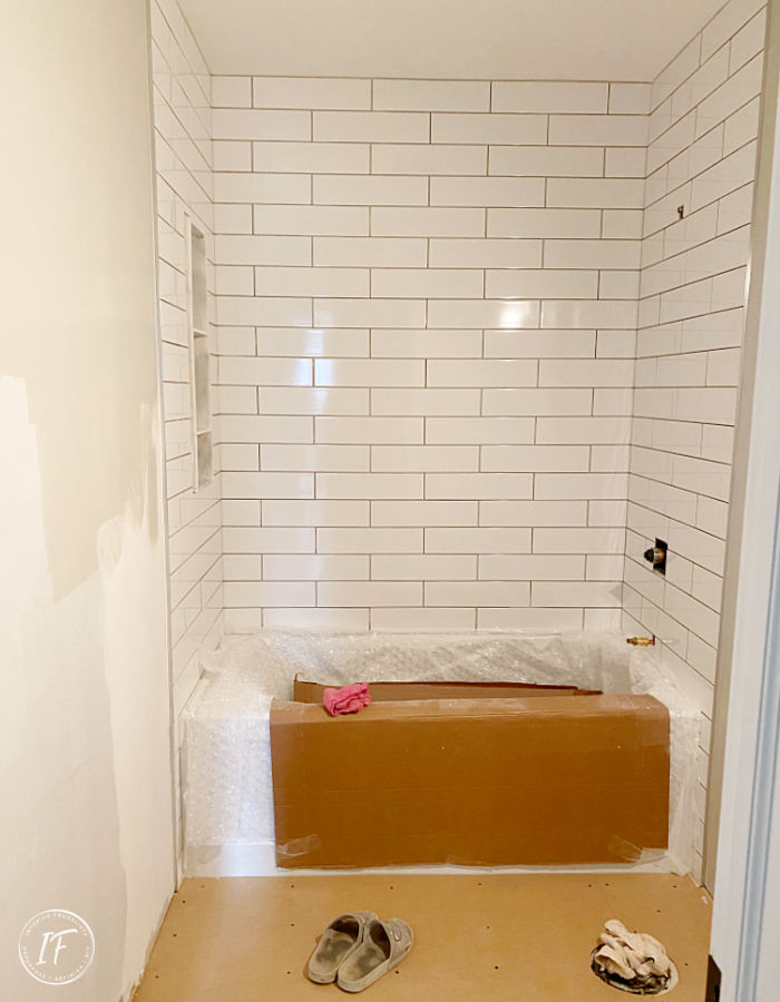 How we saved thousands of dollars on a small bathroom renovation by doing it ourselves. Before and After reveal plus full bathroom remodel checklist.