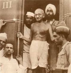 Mahatma Gandhi getting off a train