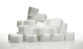 effects of sugar . Cubes of sugar with a white background