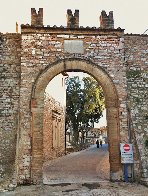 Roman walls entering the village of Spello, Umbria, Italy