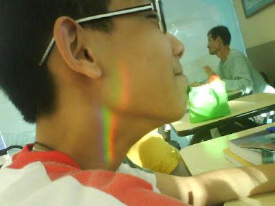 Shi peng's rainbow tattoo cause by light going through two prisms, 