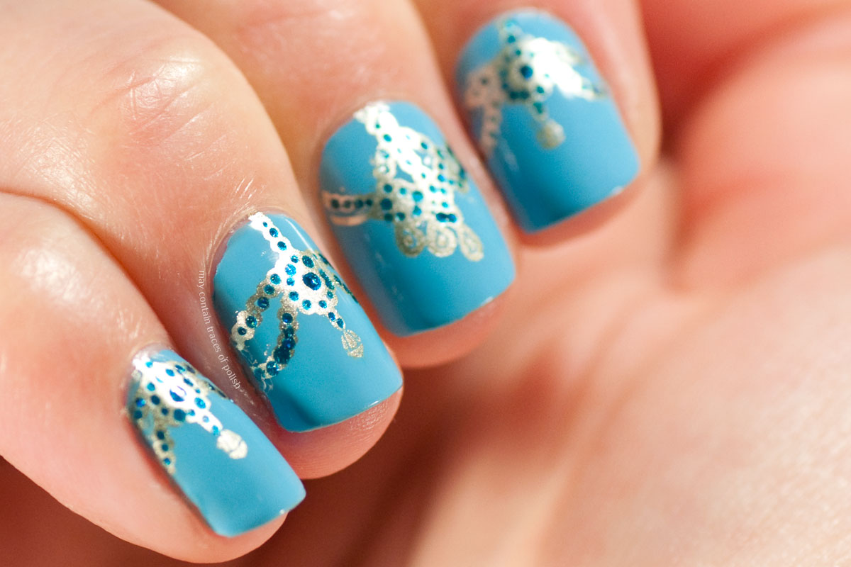 Blue Ornamental Nails stamped with MoYou London Explorer Plate 21