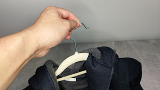 Using the hanger to hang my clothes