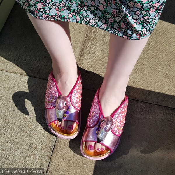 wearing irregular choice pink metallic flamingo slides with floral dress