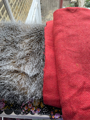 a piece of faux fur and a piece of coral wool