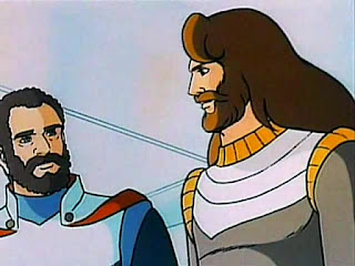 Ulises, con su look a lo Barry Gibb, hablando con Príamo en la base Troya