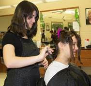 Cosmetology Junior Alexandra Ostergren from Franklin who is cutting Cloey Murphy’s hair