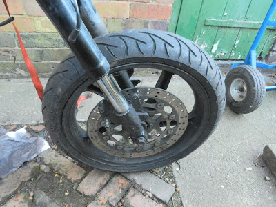 Aprilia RS 125 front wheel removal to access brake disc . remove speedo drive unit .