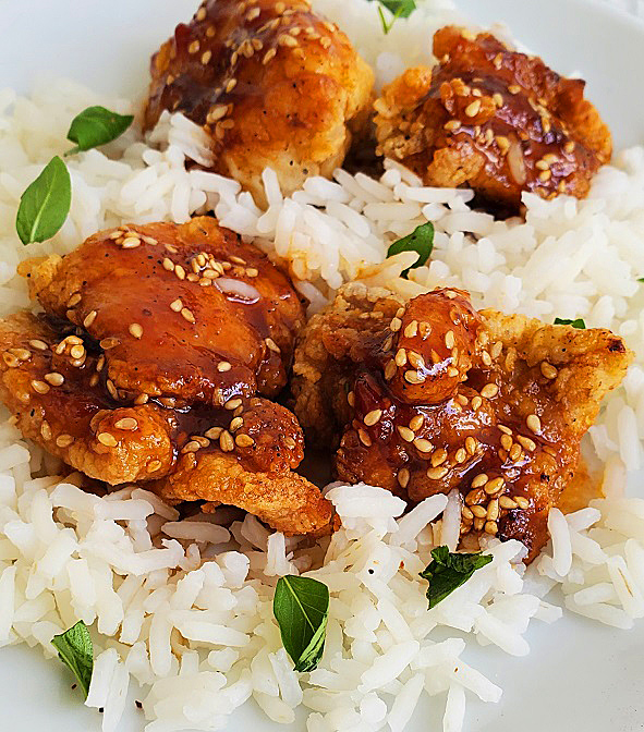 Asian sticky sauce on chicken with white rice