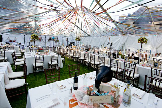 Outdoor wedding in spring under a tent photo via belle magazine
