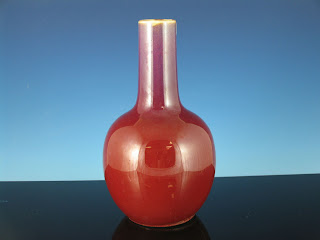 <img src="Chinese Langyao vase .jpg" alt="deep copper red glaze and raw foot">