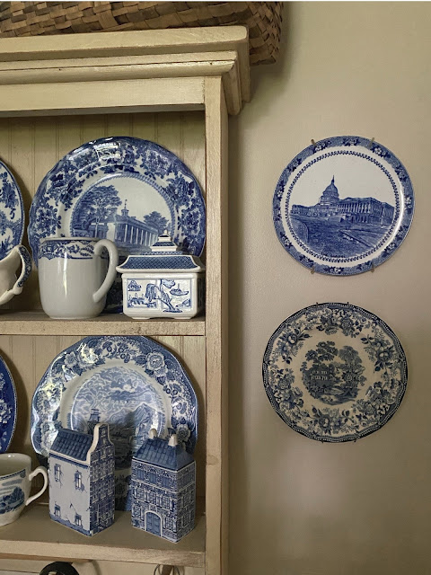 blue and white transferware plates display