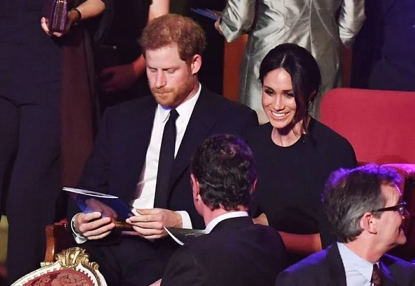 Meghan Markle wore Stella McCartney Stella Cape Dress, Manolo Blahnik pumps, Naeem Khan clutch. Countess Sophie of Wessex and Lady Louise