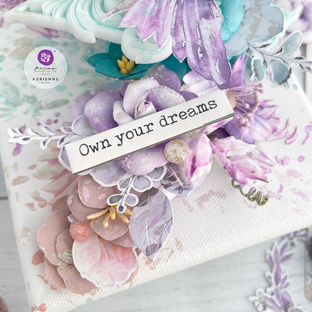 Mixed media canvas featuring a hummingbird and paper flowers from the Prima Marketing The 3 Girls Tale collections Lost in Wonderland, Postcards from Paradise and Aquarelle Dreams.