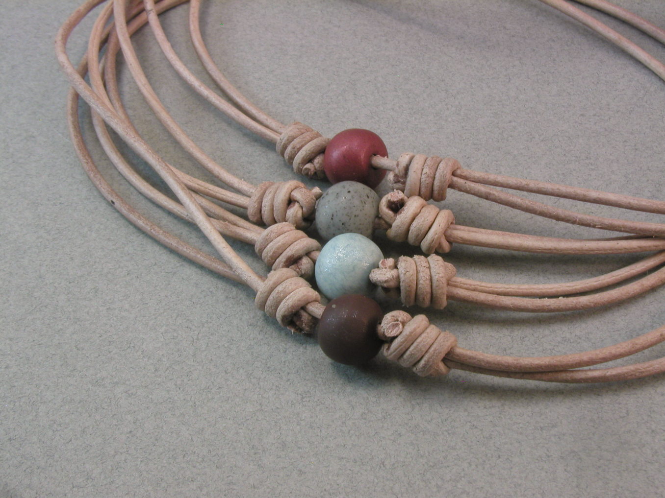 Knots and fiber bracelets: knotted cord bead necklaces 3997