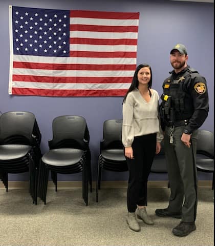 Sheriff and woman standing for photo