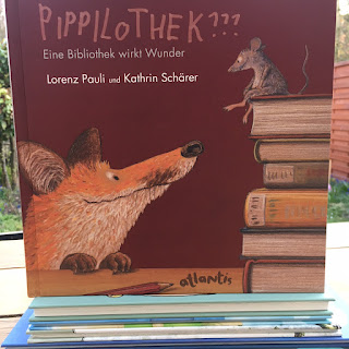 "Pippilothek - Eine Bibliothek wirkt Wunder" von Lorenz Pauli und Kathrin Schaerer, atlantis Verlag, Bilderbuch ab 4 Jahren, ein Buch über das Lesen, auch super für die Grundschule, Rezension auf Kinderbuchblog Familienbücherei