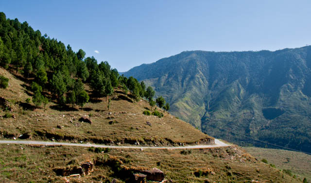 Beautiful Journey till Baghipul on third day of MTB Himachal 2010 : Posted by VJ SHARAMA on www.travellingcamera.com : On third day, we had lunch at a very beautiful place which was situated on a very high mountain on the way to nirmand... We had a 30 minutes break for lunch and moved for next milestone... Some part of this road was really scary and beautiful as well.. Just have a look at some of the photographs clicked post lunch and this journey completely at baghipul.. but that was not the last destination.. everyone had to ride the bikes for 12 kilometers.. It was free ride but it took a lot of time because of the rough road till Kullu Sarahan...All such seens were very scary but as I have mentioned many times that we learnt over the time that riders are much more efficient & alert as we used to think... They had full control in spite of amazing speed on these roads... Be it a downhill or an uphill, they were simply amazing... Many times it was frustrating for photographers because our van was not able to catch up with their speed...Shadows are telling about the time and now its less than 1/4th of the stretch but most time consuming, especially Baghipul to Sarahan Village... I hope you noticed snow covered hills in the background :)A new road, just created by Patel Contructions Ltd.. There was a huge project going on near the Satluj River... Lovely views from this place and we couldn't afford to have a break and shot the beauty there.. All these photographs have been clicked from a moving van....Beautiful landscapes but no time to shoot them :( .... Whole group had to be very fast because we needed more time during the last stretch where we had to climb a hill with the slope of 70 degree and it was 12 kilometers from the base site to the main camping area in Sarahan... This place are parallel to Shrikhand Mahadev...Even the peaks with snow cover are a part of Shrikhand mountain range ... One of the popular trek in Himachal Pradesh... Actually it was a pilgrimage site but now a days many trekkers go their to experience amazing beauty of the nature...Roads... 8 days on roads but all were different and more exciting for riders... They always got a new challenge during each day of MTB Himachal 2010...A view of Satluj River from the road which connects Shimla with Nirmand Village or base site for Shrikhand Mahadev(jaon village)...Here is another side of Satluj.. Both the photographs have been clicked from same place... This one is the left side and above one is of right side... wonderful view of Satluj in the middle of very high hills of Himalayas...Another Photograph of Satluj river flowing through Himalayan ranges.. Photograph click during MTB Himachal 2010...Main profession in Himachal - Agriculture and the fields are shining like anything... 