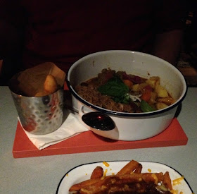 picture of curry in a bowl and chips