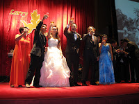 The bridal couple and family having a grand toast with their guests