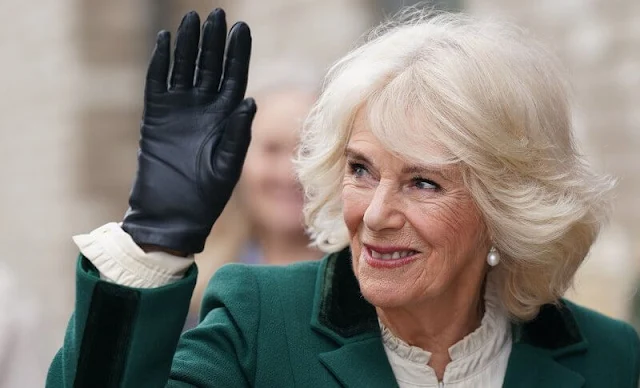 Queen Camilla wore a green wool jacket and skirt, suit outfit, and white silk blouse, and black suede boots