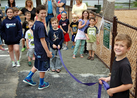 then it was time for some eager youths to cut the ribbon to the playground