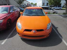 Custom orange paint job on 2006 Mitsubishi Eclipse from Almost Everything Auto Body.