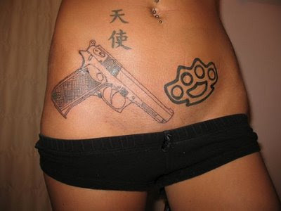 revolver tattoos. girls with guns tattoos. girls