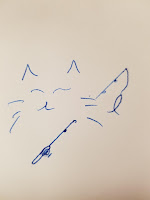 drawing of a cat face with a fishing pole and a very small fish