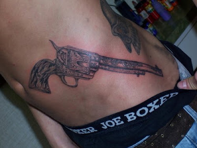 Gun tattoos are often seen as a tough symbol They tend to be an emblem of
