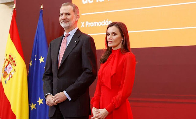Queen Letizia wore a red silk pussy-bow blouse by Bimani and a red silk midi skirt of Spanish fashion brand Bimani