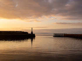 Photo of the sun going down over Maryport Basin