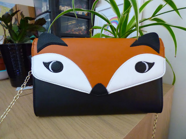 The best novelty clutch and shoulder bags: Rectangular leather bag, with a fox face made from orange, black and white leather