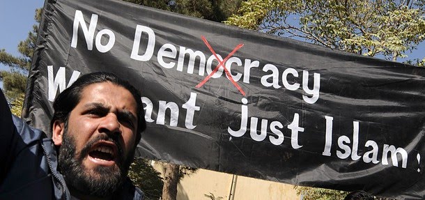 [Afghan+university+students+shout+anti-US+slogans+and+hold+a+banner+reading+'No+Democracy;+We+want+just+Islam!'+during+a+demonstration+in+Kabul+on+October+25,+.jpg]